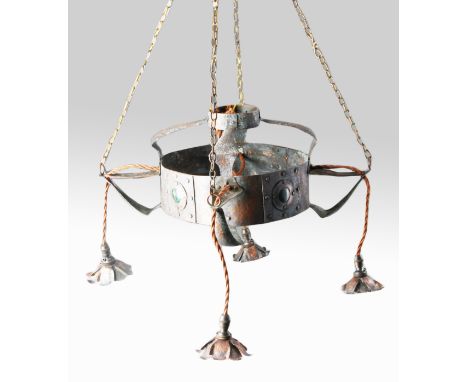 An arts and craft copper hand beaten light fitting, with four flower head droppers.