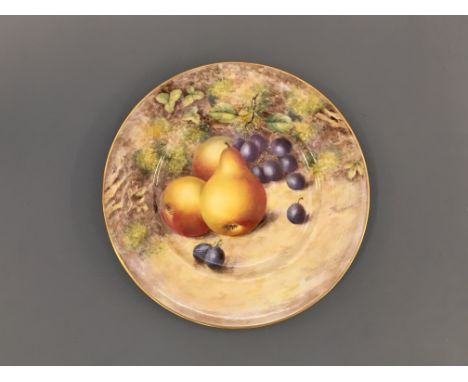 A Royal Worcester plate signed J. Freeman of pears and berries.