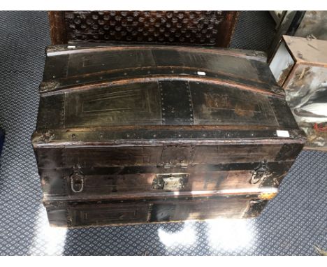 A metal and wood bound Victorian arched top trunk by John Norgrove, with makers label.