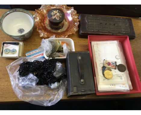 A selection of various coins, post cards, a Kodak camera, beaded accessories, carnival dish, two royalist medals, painted box