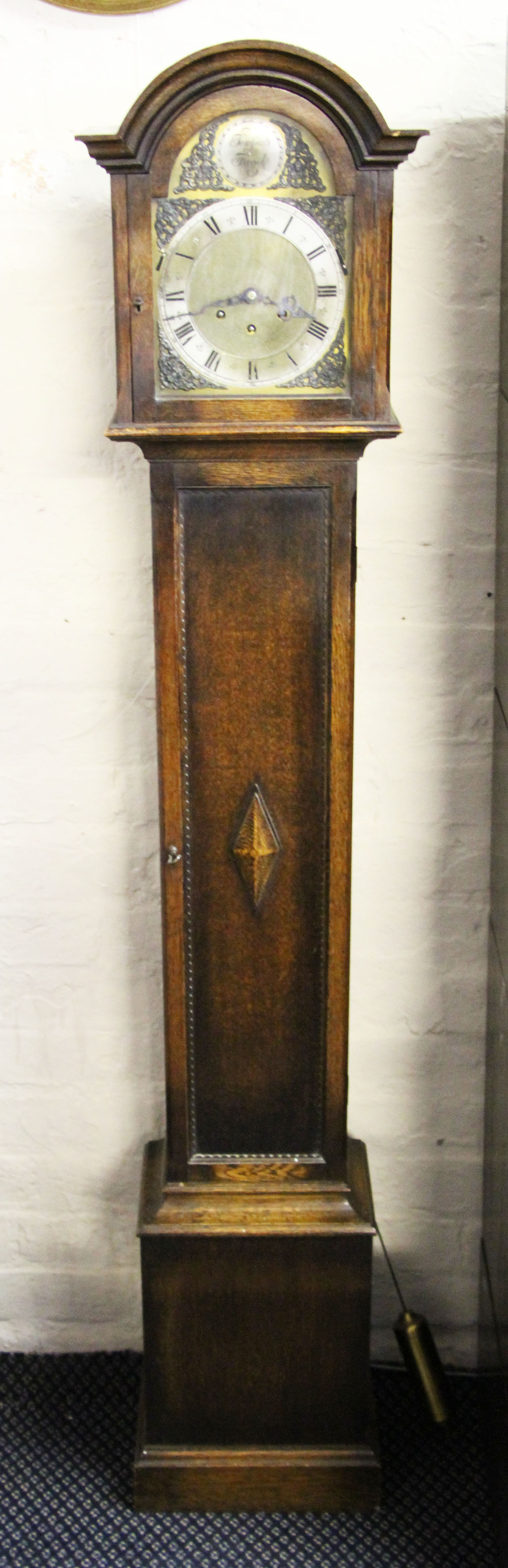 A Tempus Fugit grandmother clock with Westminster chimes.