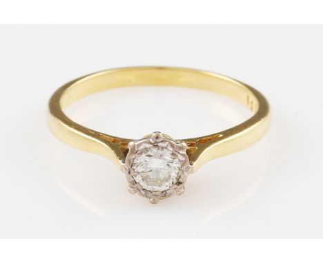 An 18ct yellow gold diamond solitaire ring, illusion set with a round brilliant cut diamond, approx. 0.40ct, hallmarked Londo