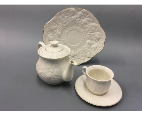 A 23 piece Belleek tea service to include six cups and saucers, sugar bowl etc.