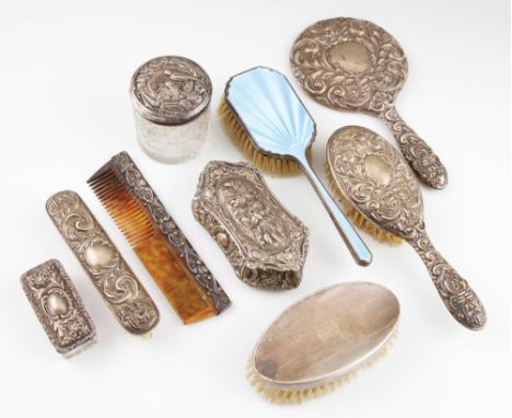 A collection of silver dressing table items, to include an enamel hair brush, hallmarked Birmingham 1934, a set of three item