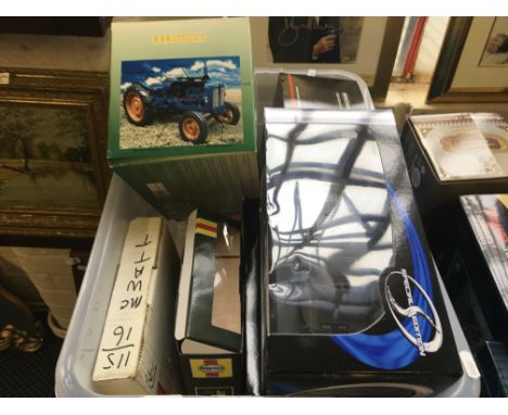 A box containing a quantity of model clock cars, to include Masteo Citroen 2CV, tractor, Jaguar E type etc.