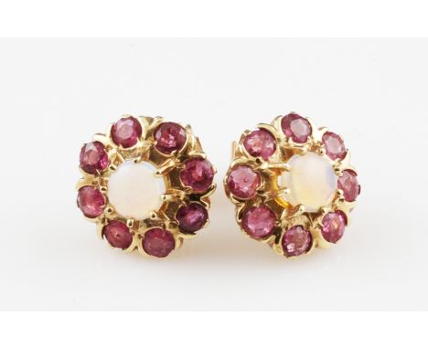 A pair of 9ct yellow gold ruby and opal cluster stud earrings, set with a central round opal cabochon, diameter approx. 5mm, 