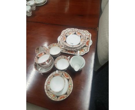 comprising of cups, saucers, side plates and sandwich plate (20) 