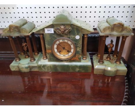 the architectural mantle clock together with two figural garnitures 
