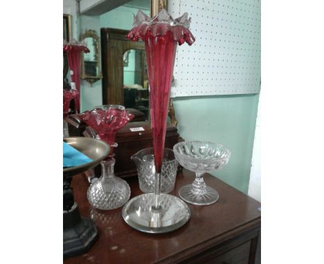 including a cranberry glass centre piece with a mirrored base, a cut glass tazza and other cut crystal 