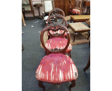 the button upholstered seats terminating in cabriole legs 