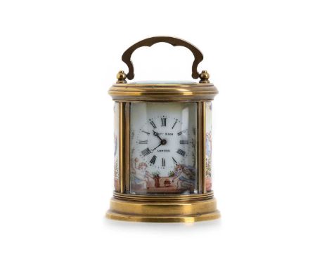 EDWARDIAN CARRIAGE CLOCK, BY ELLIOT & SON  of circular form, with black Roman numeral hour markers on hand painted porcelain 