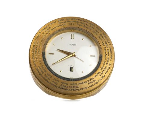 LUXOR DESK CLOCK, retailed by Asprey, the circular dial with subsidiary calendar, within a gilded brass bezel inscribed with 