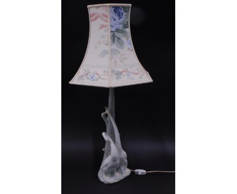 A Nao lamp, mounted with stork and two geese figures, with a floral shade, 50cm high. 