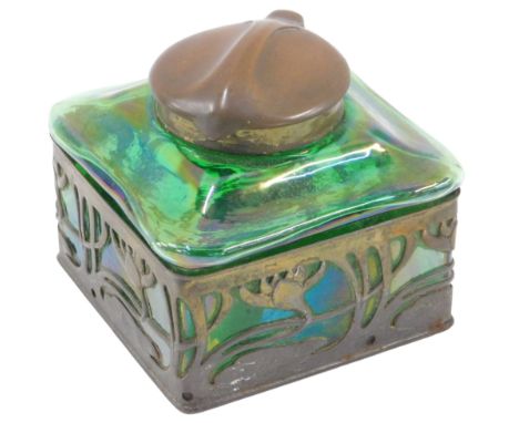 An Art Nouveau brass and green Loetz style glass inkwell, the domed and moulded cap top, on a square set floral base, 8cm hig