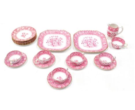 A Copeland 20thC tea service, on a white ground with pink borders and flowers, comprising six cups and five saucers, six side
