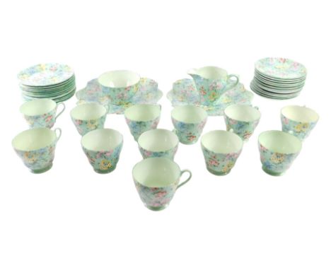 A Shelley Melody pattern part tea service, comprising two rectangular cake plates, milk jug, sugar bowl, twelve teacups, twel