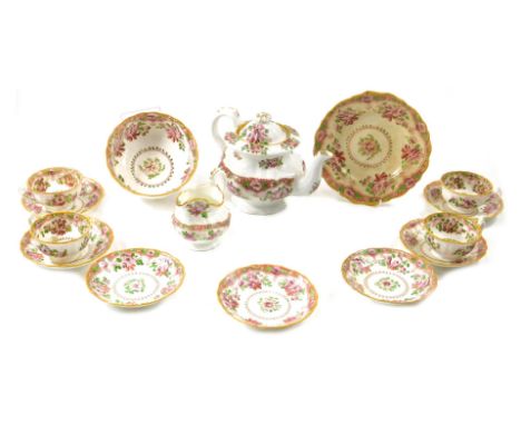 A 19thC Staffordshire porcelain part tea service, printed and painted with flowers in Chinese style. (AF)