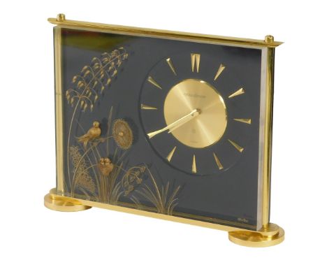 A Jaeger-LeCoultre Marina desk clock, with a black and gilt decoration of floral sprays and birds, with Swiss eight day movem