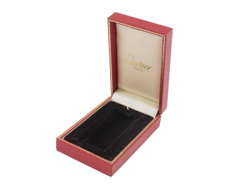 A box for a Cartier cigarette lighter in red, stamped Cartier Paris. 