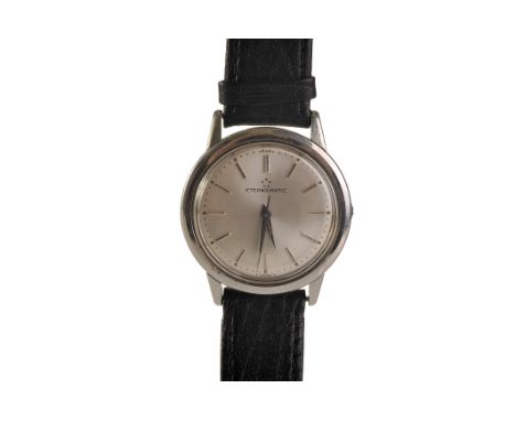 A 1950s Eterna-Matic gentleman’s stain­less steel automatic wristwatch, the signed silvered dial with applied baton markers a