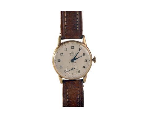 A 1950s Smiths gentleman’s 9ct gold wrist­watch, the matt cream dial with applied gold Arabic numerals, blued steel hands, an