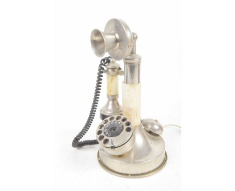 A 1930's/40's candlestick type telephone The chromed base, speaker and dial further detailed with an onyx stem, sold electric