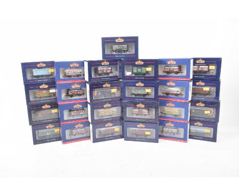 Twenty-five small boxed Bachmann '00' gauge wagons, tankers etc. of various types.