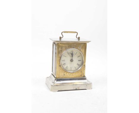 An early 20th Century chrome cased bracket clockThe outer face having gilt scrolls surrounding a central dial with Roman numb
