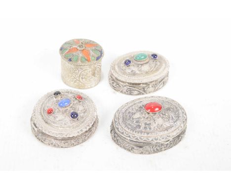 A collection of South East Asian white metal and enamel boxesEach of the various chased and engraved filigree style lidded bo