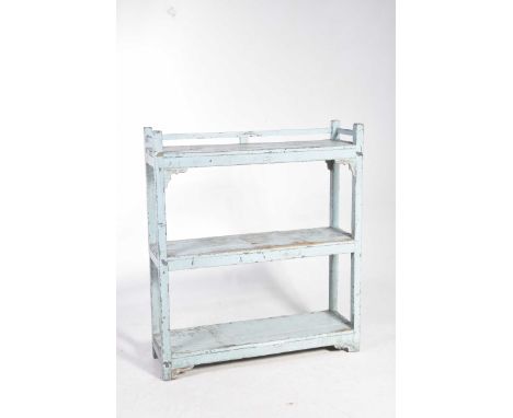 A painted rustic hardwood set of open shelvesWith a galleried top shelf above two lower shelves supported on uprights of squa
