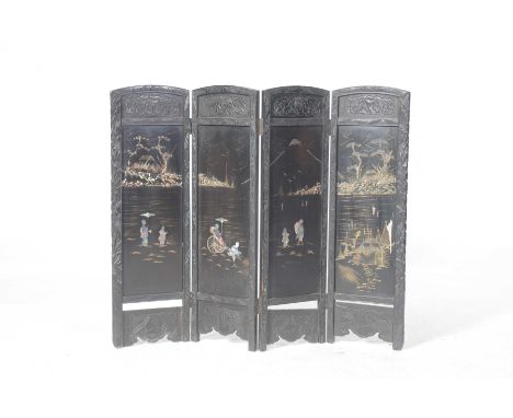 A Japanned ebonised hardwood three fold screenEach panel decorated with Mother of Pearl applied figures within a pagoda lands