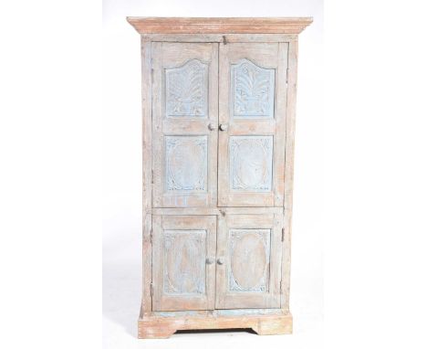 A rustic hardwood continental style housekeepers cupboardWith a moulded cornice above a pair of panelled and carved doors enc