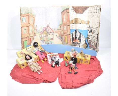 A boxed Pelham Puppet TheatreTogether with four puppets, Cat in white box, SS Golly Wog, MacBoogle and Fairy all in yellow bo
