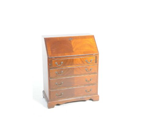 A Georgian style mahogany bureau, 20th CenturyThe fall front enclosing a compartmentalized interior above four graduated long