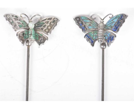 Two Edwardian Charles Horner butterfly hatpinsEach enamelled with green and blue with butterfly designs, and tapered pin, 12c