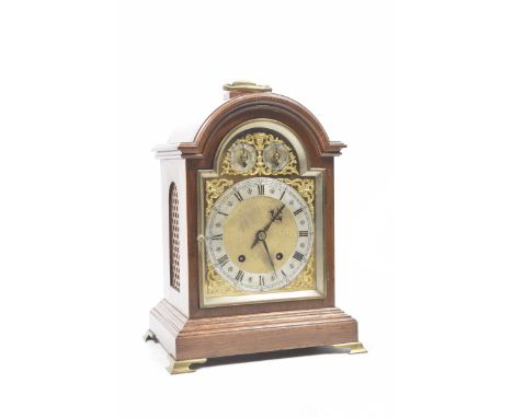 An early 20th Century good quality oak cased bracket clockWith gilded face and silvered dial, retailed by Goldsmiths & Silver