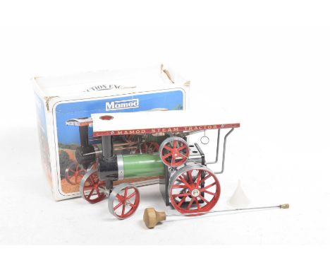 A boxed Mamod steam traction engine C.E.1A With green body, white roof, red wheel hubs, complete with vapourising spirit lamp