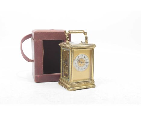 A French 19th Century brass cased repeating carriage clockHaving silvered dial with Arabic numerals, height 17cm, complete wi