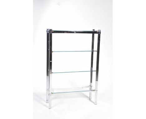 A contemporary chromed metal and glass freestanding shelf unitThe unit with four glass shelves each with canted corners raise