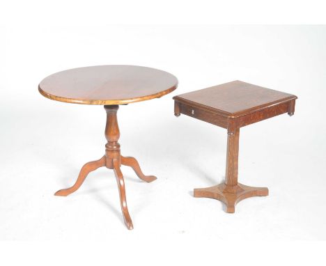 A late Victorian oak tripod table and a stained mahogany tripod tableThe oak table with a rectangular moulded top above a sin