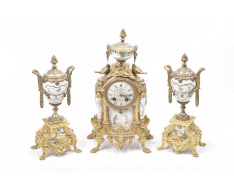 A French 19th Century ormolu and sevres porcelain clock garniture The clock having bulbous porcelain urn finial with gilt mou