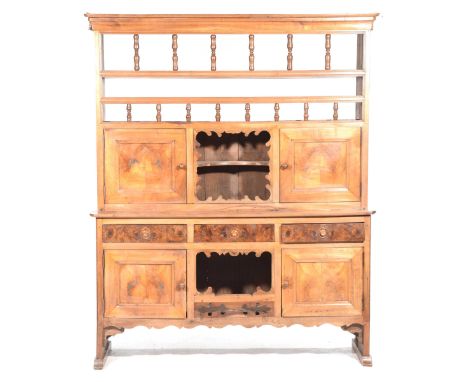 A rare and attractive French cherry wood kitchen dresserThe raised back with a moulded cornice above two galleries of turned 