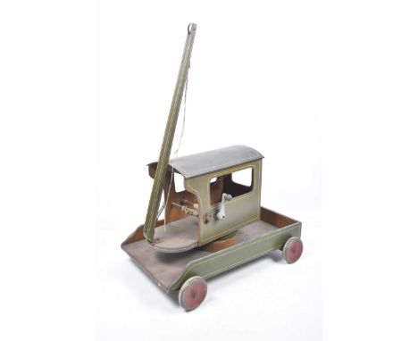 A wooden model crane With four wheels, painted in green and grey, with green jib 'F.H. Hackney, Contractor, Sandbach, Cheshir