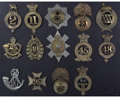 A collection of x14 assorted First, Second World War (and other) British Military uniform cap badges to include; Royal Welsh 