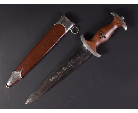 A WWII Second World War Third Reich Nazi German SA Officers dress dagger. The dagger having a shaped wooden grip with inset S