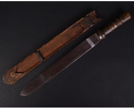 A 19th Century Bhutanese ethnic knife / dagger with wooden grip and sectioned brass collars. The wide single edged blade hous