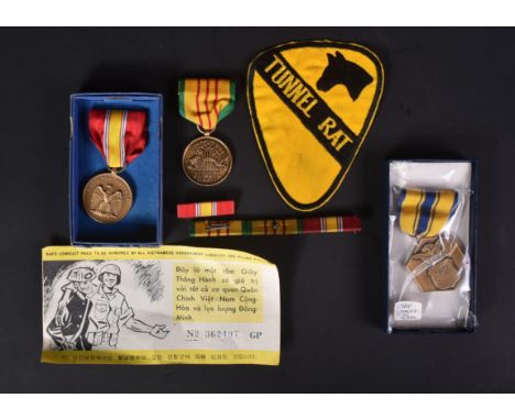 Vietnam War - a collection of items relating to the conflict to include; a Tunnel Rat cloth uniform patch, Republic Of Vietna