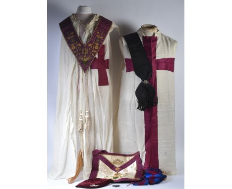 An original Masonic Knights Templar uniform regalia comprising mantle and tunic, maroon velvet cap, black sash with silver do