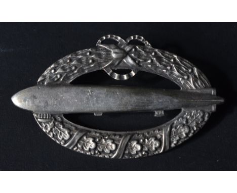 A post WWI First World War Imperial German Army Zeppelin badge. Horizontal oval shape with an airship facing left superimpose