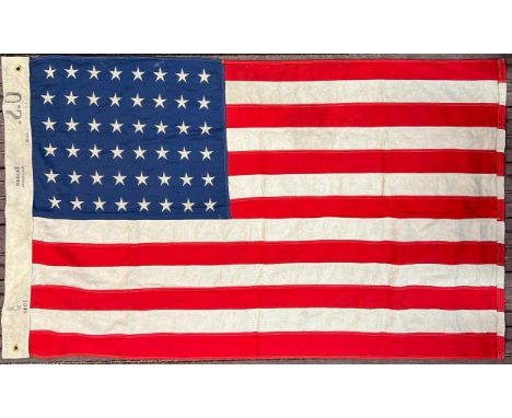 A WWII Second World War interest US United States Stars and Stipes flag. Typical form with x48 stars to the panel. Marked to 